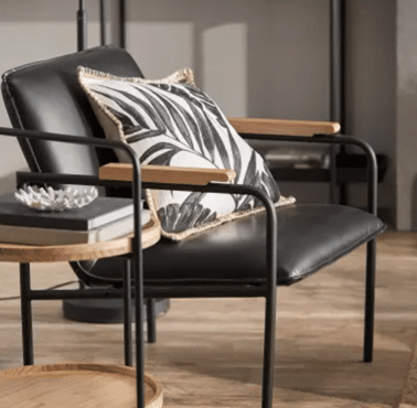 Fauteuil en métal et en cuir synthétique noir